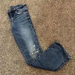 American Eagle bootcut jeans with rips in the knee